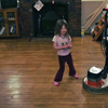 Lola, dancing with a floor-polisher